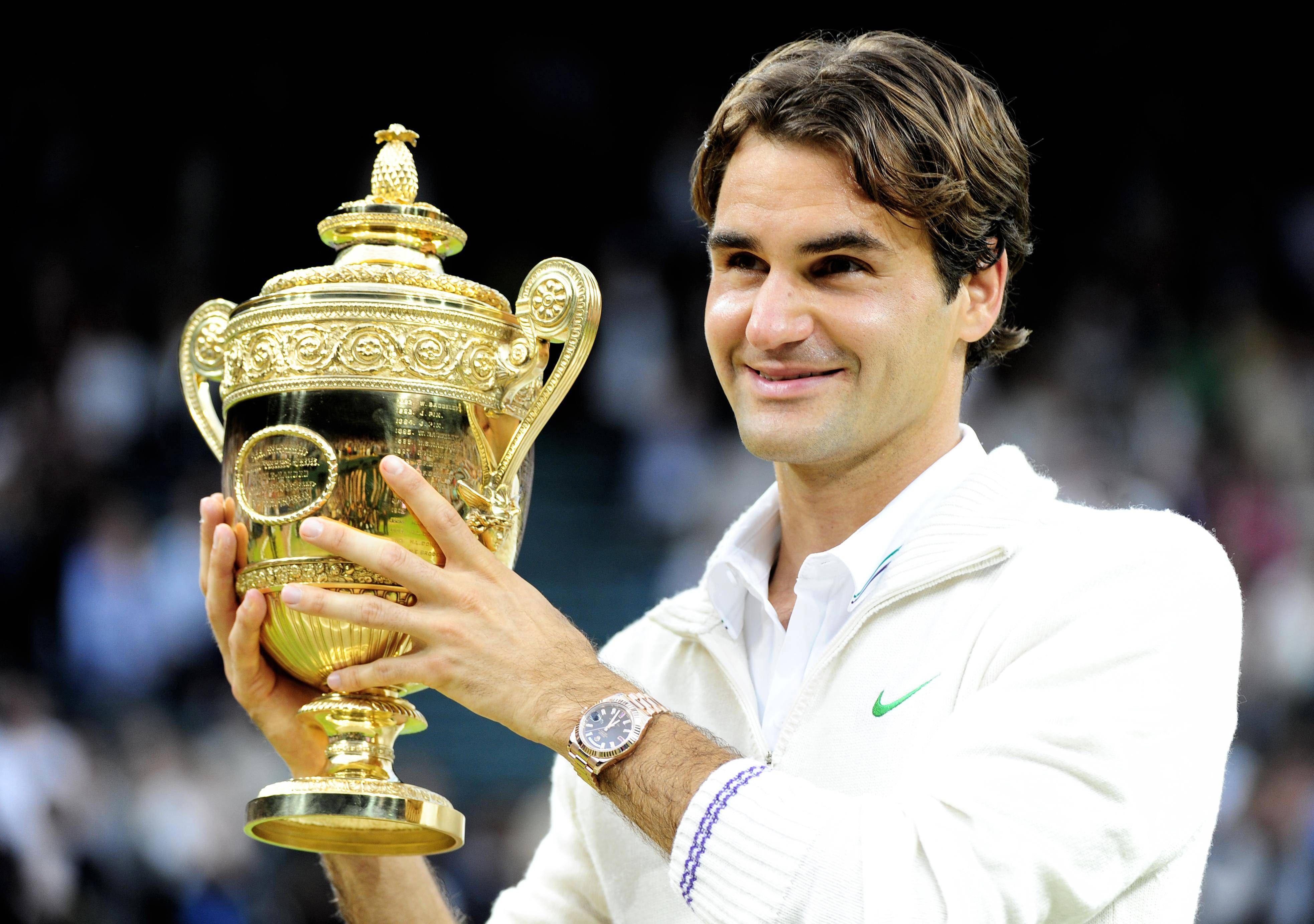 roger federer started playing tennis at age