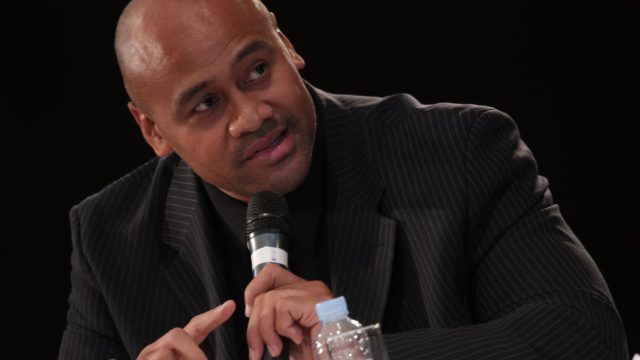 Jonah Lomu running with the ball during a rugby match