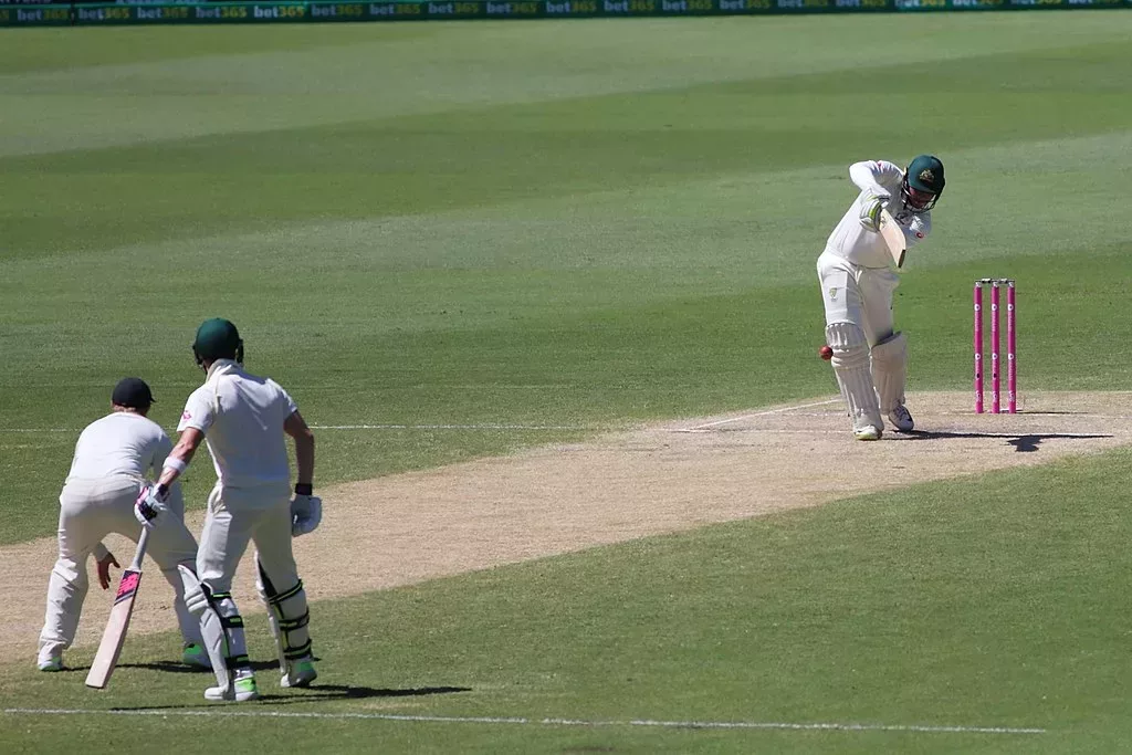 Usman Khawaja drives, Steve Smith backs up