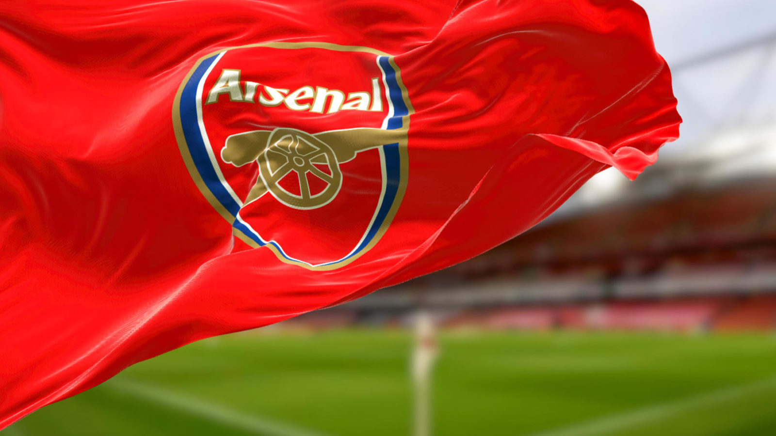 The flag of Arsenal Football Club waving in the stadium