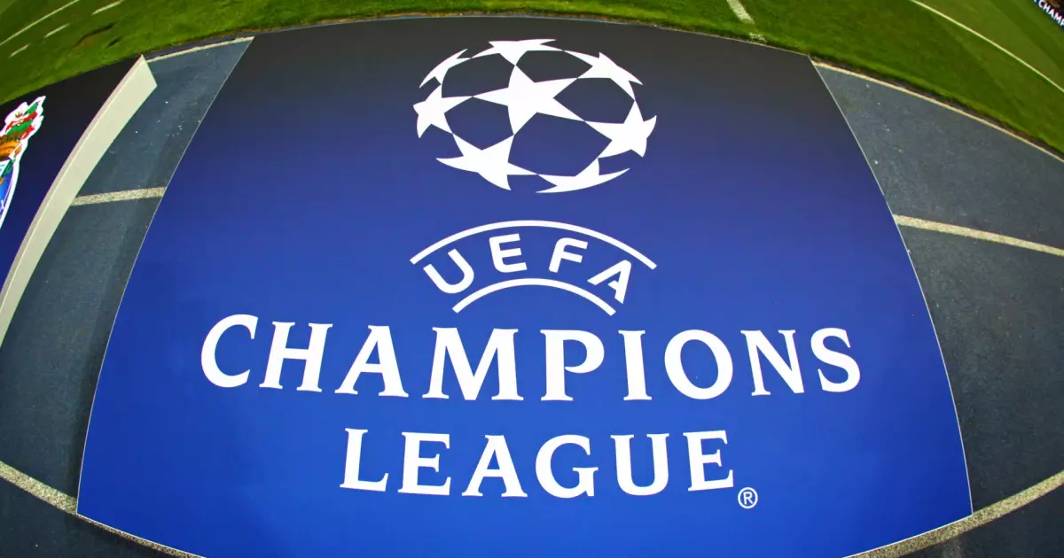Board with UEFA Champions League Logo on the ground