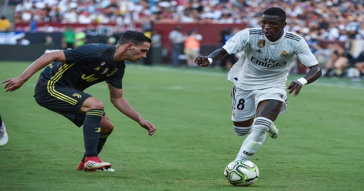Explore the potential transfer of Vinicius Jr from Real Madrid to Manchester United and the reasons Kylian Mbappe has for staying at PSG.
