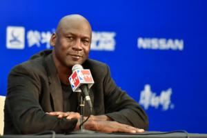 Michael Jordan Net Worth: Michael Jordan celebrating on the court, symbolizing his net worth and success.