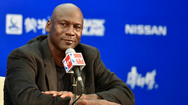 Michael Jordan Net Worth: Michael Jordan celebrating on the court, symbolizing his net worth and success.