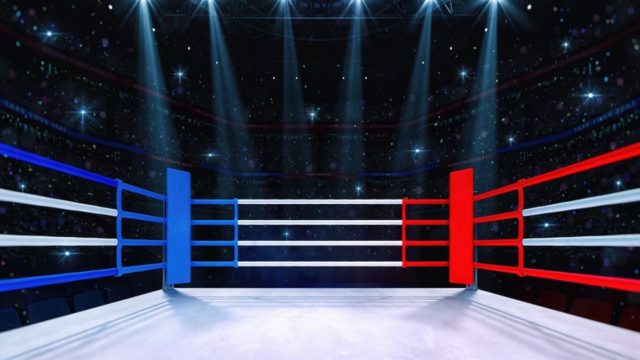 Félix Trinidad celebrating a boxing victory with raised arms in the ring