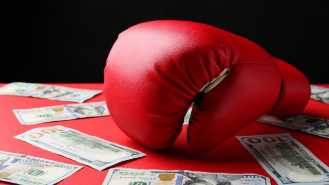 The Top 10 Richest Boxers in the World Standing in a Ring with Luxury Background