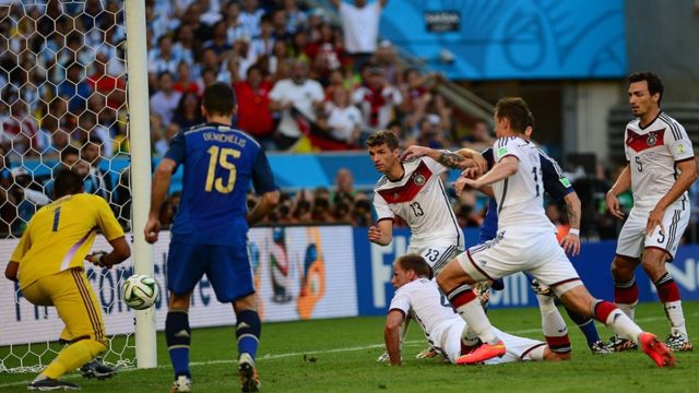 Philipp Lahm and the 2014 Germany World Cup squad lifting the World Cup trophy in Rio de Janeiro