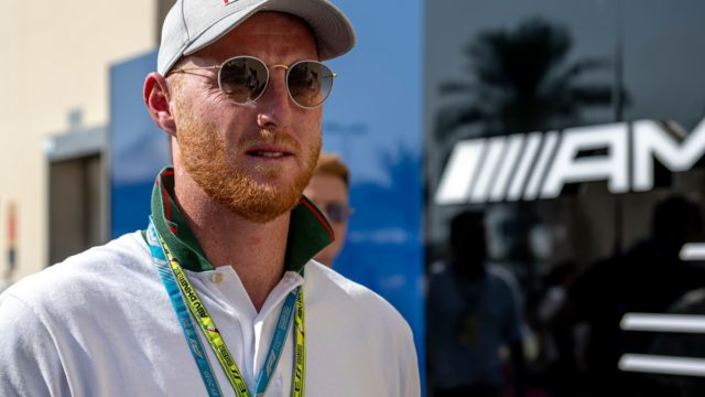 Ben Stokes raising his bat after a century for England, symbolising his success and £8 million net worth.