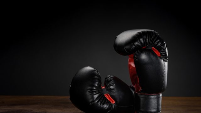 Chris Eubank Sr posing in the ring in his trademark pose during his boxing prime