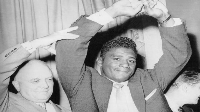 Cus D’Amato mentoring a young boxer in training