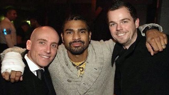 David Haye celebrating a boxing victory in a packed arena ring