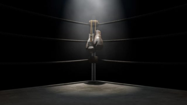 Legendary boxing trainer Eddie Futch giving advice in the ring corner