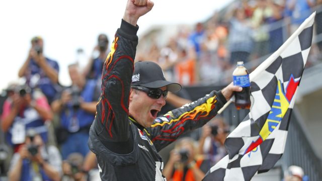 Jeff Gordon celebrating victory with his No. 24 car in NASCAR