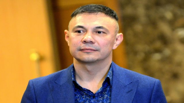 Kostya Tszyu celebrating a world title boxing victory in the ring