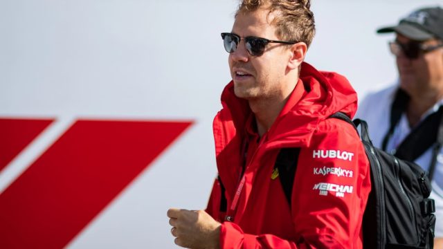 Sebastian Vettel celebrating a Formula 1 victory representing his $140 million net worth and racing legacy