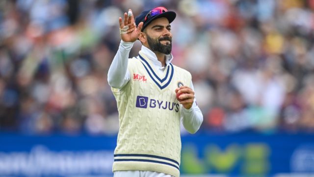Virat Kohli smiling during a match representing India