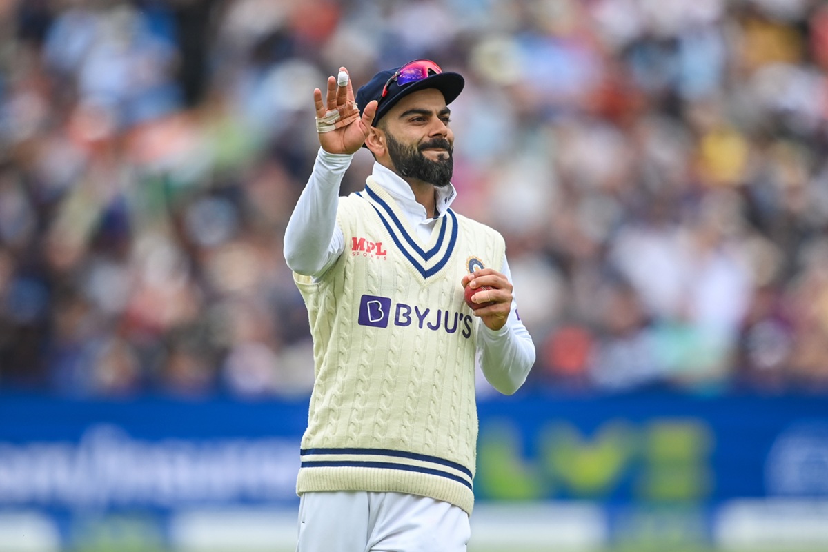 Virat Kohli smiling during a match representing India