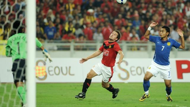 Michael Owen celebrating after scoring, for a Michael Owen net worth and career highlights article