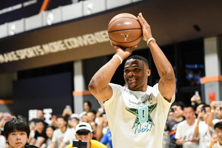 Basketball player achieving a triple double during a professional game