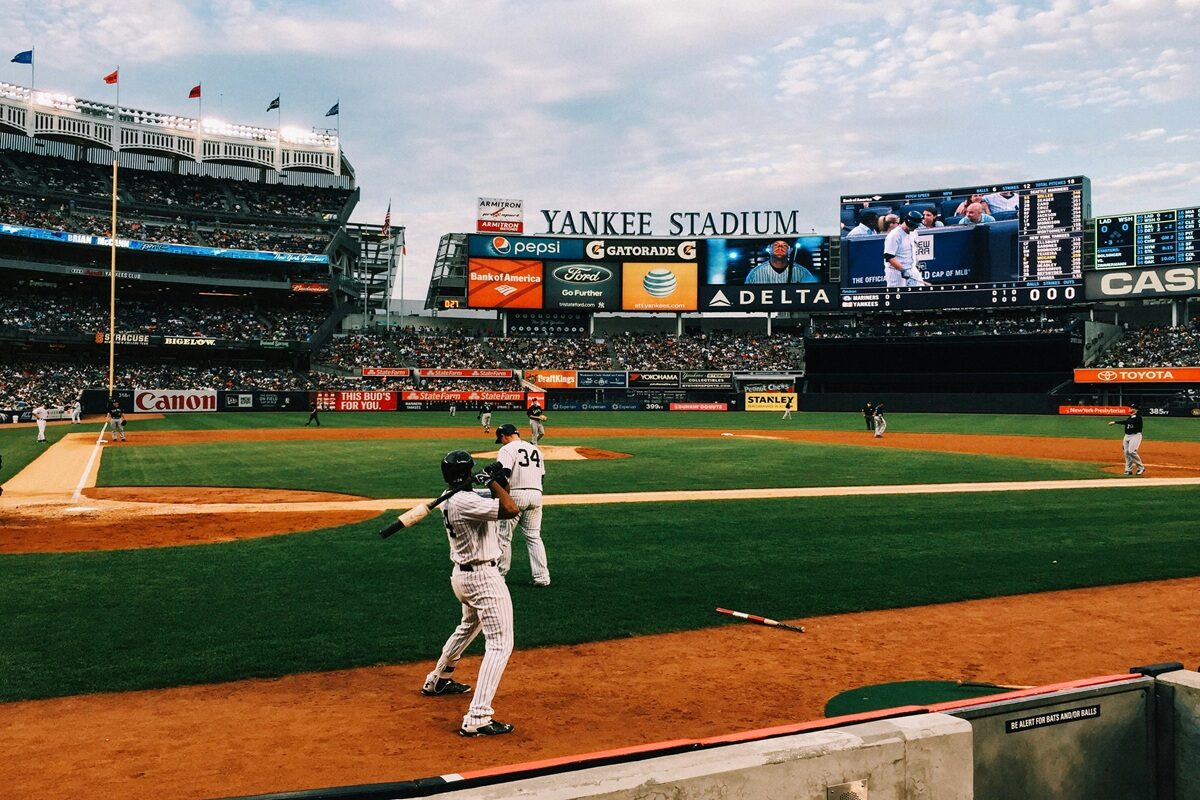 Baseball stadium scene representing the 2026 MLB home run race and leading power hitters.