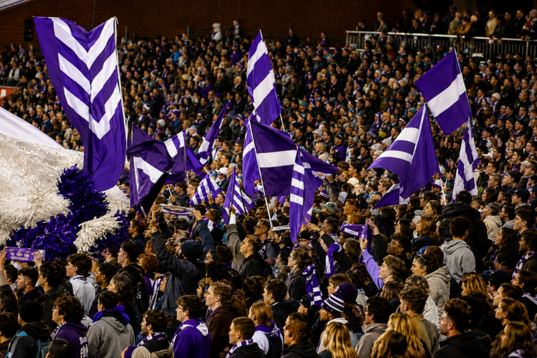 Fremantle players celebrate during their AFL 2026 Round 9 comeback win over Hawthorn at Optus Stadium