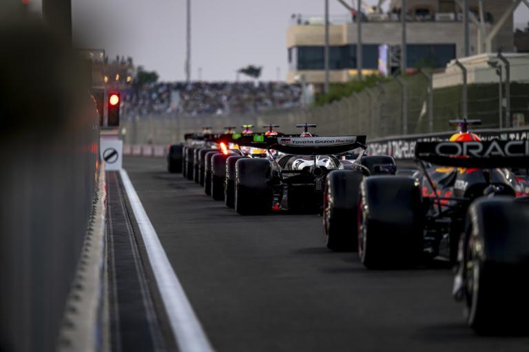 Formula 1 cars lined up on the grid before a Grand Prix race start